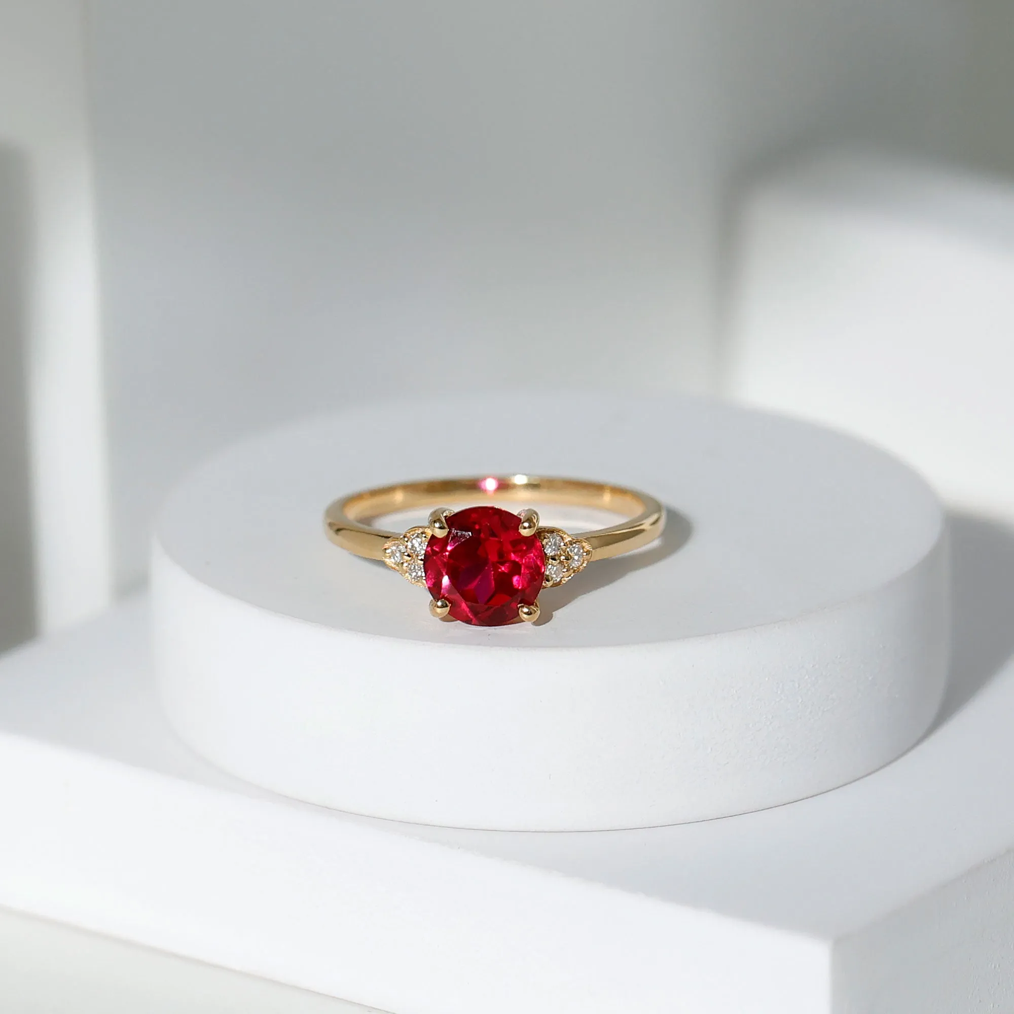 Lab Grown Ruby Solitaire Engagement Ring with Diamond Trio