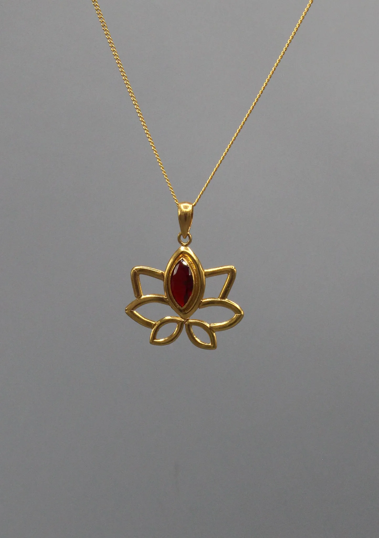 Oval Garnet inlaid Gold Plated Lotus Pendant